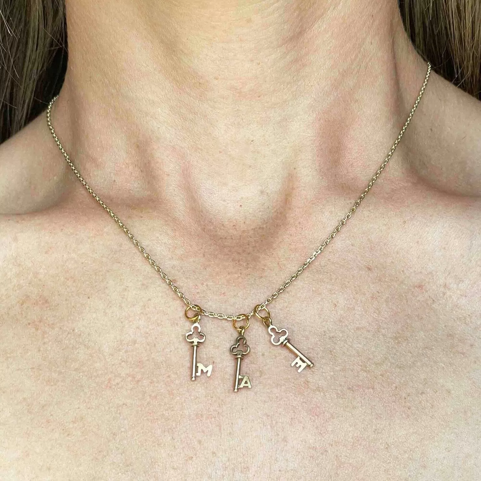 A Monogram Skeleton Key Necklace in 14K Gold