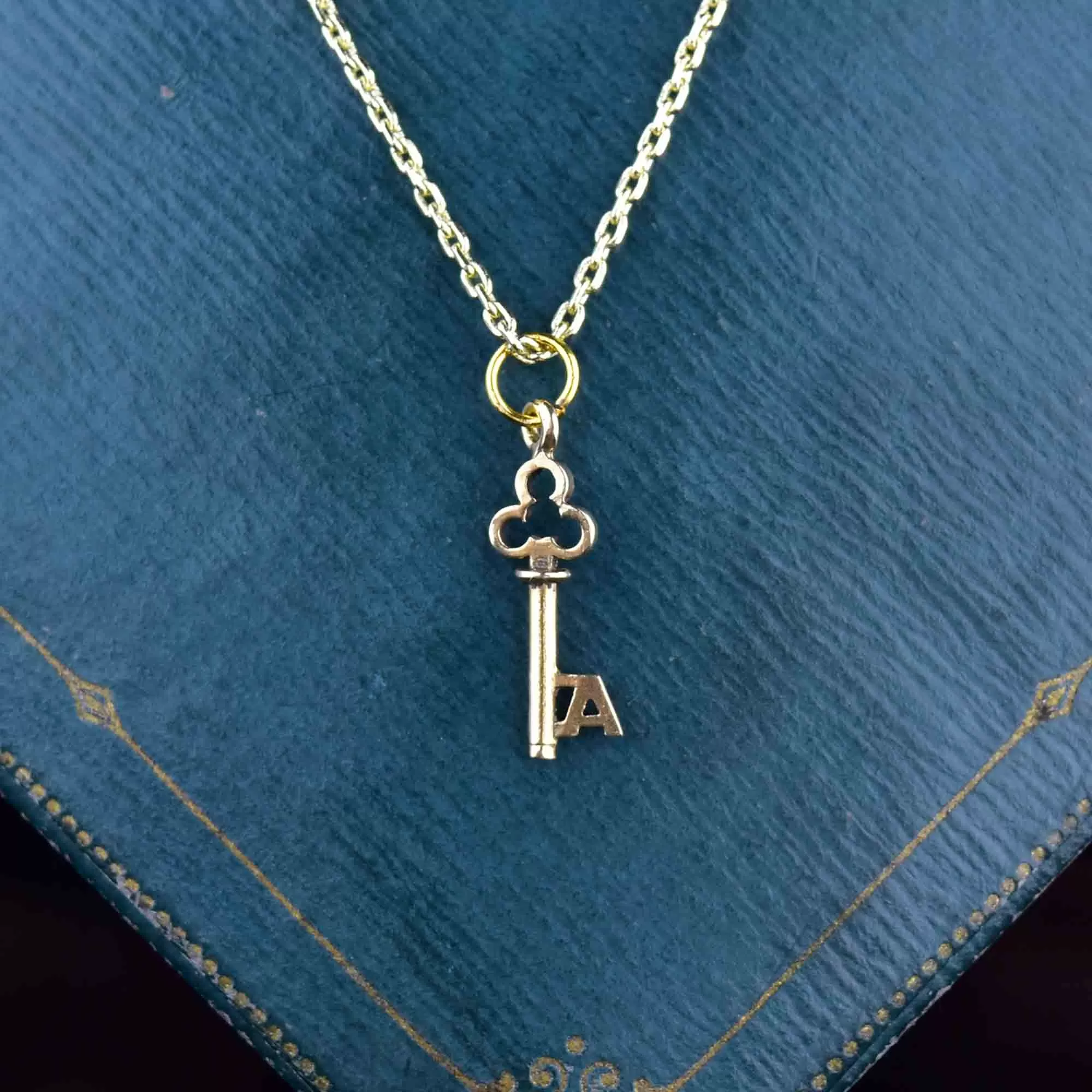 A Monogram Skeleton Key Necklace in 14K Gold